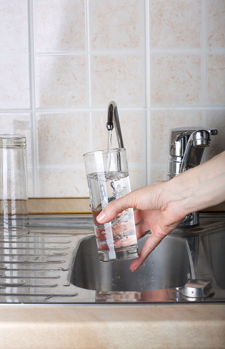 Clean shower glass after treating hard water with filtered water for Streak free cleaning