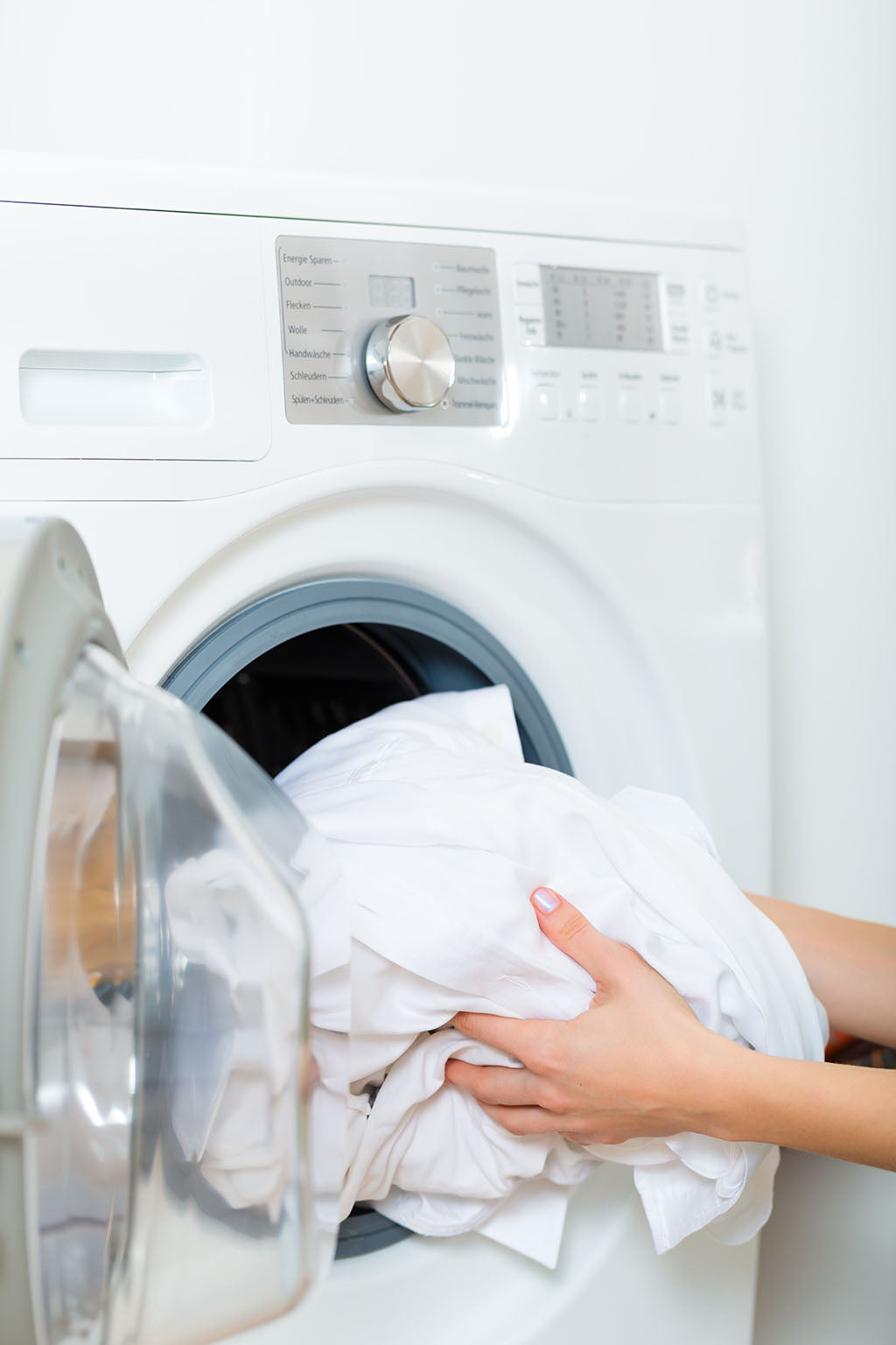 Soft laundry and clean fabrics after fixing hard water with a water treatment water softener system