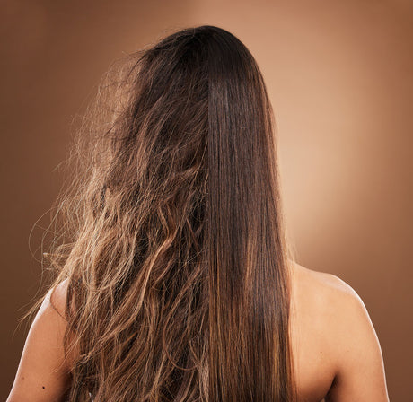 Woman examining hair health concerns related to hard water in Riverside, California home in Riverside,, California