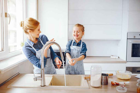 Homeowner reviewing water softener options and sizing guide for residential installation