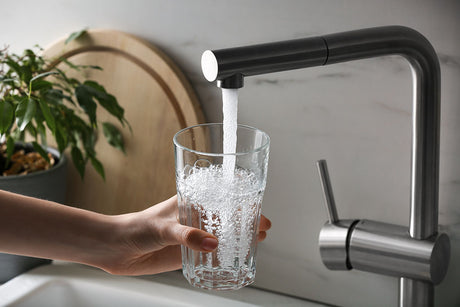 Homeowner checking water softener brine tank during troubleshooting for regeneration failure