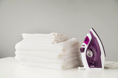 Homeowner in Fort myers, Florida examining soft laundry after installing a water softener system in Fort Myers,, Florida